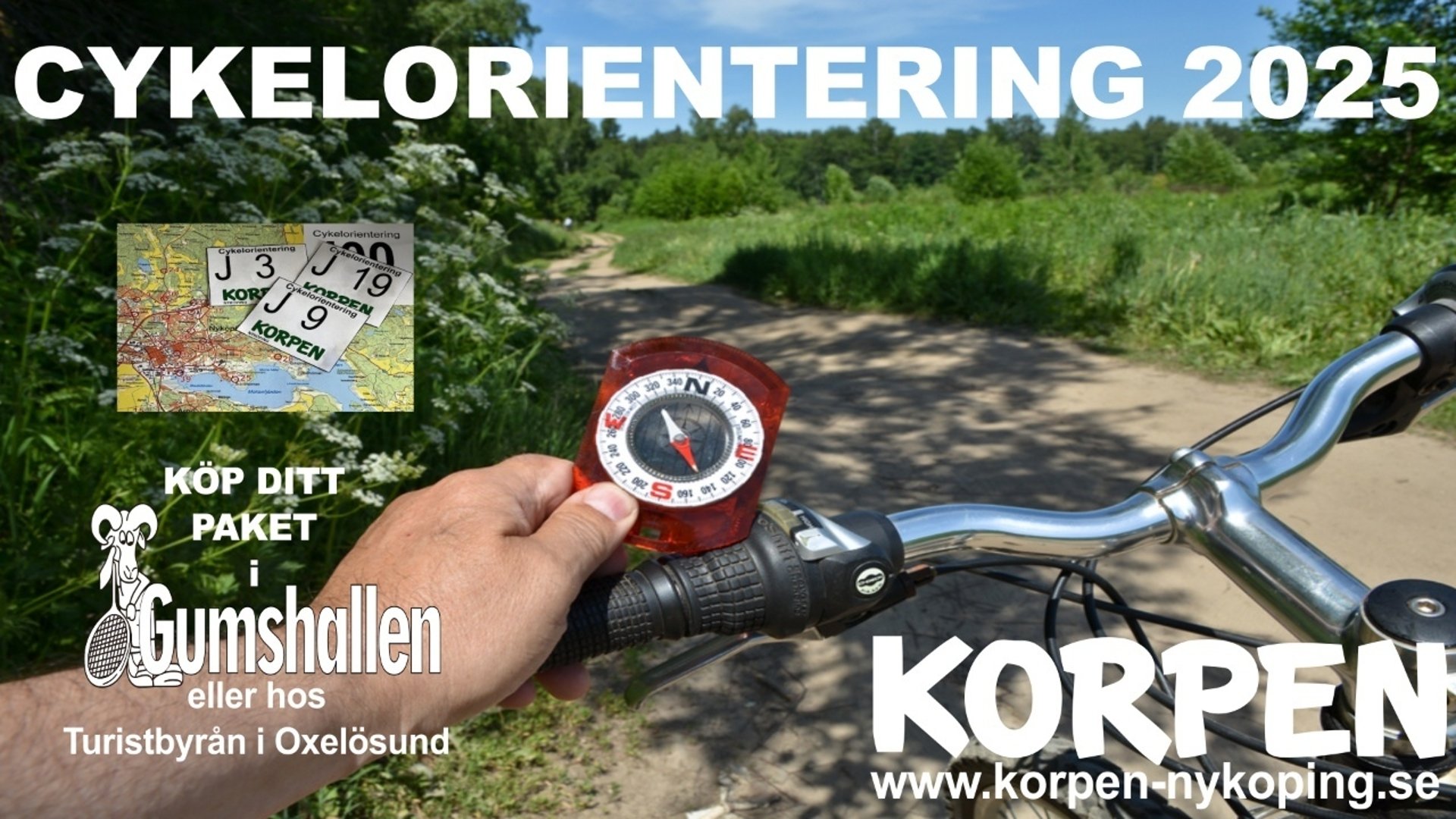 Cykelstyre med kompass i naturskön miljö