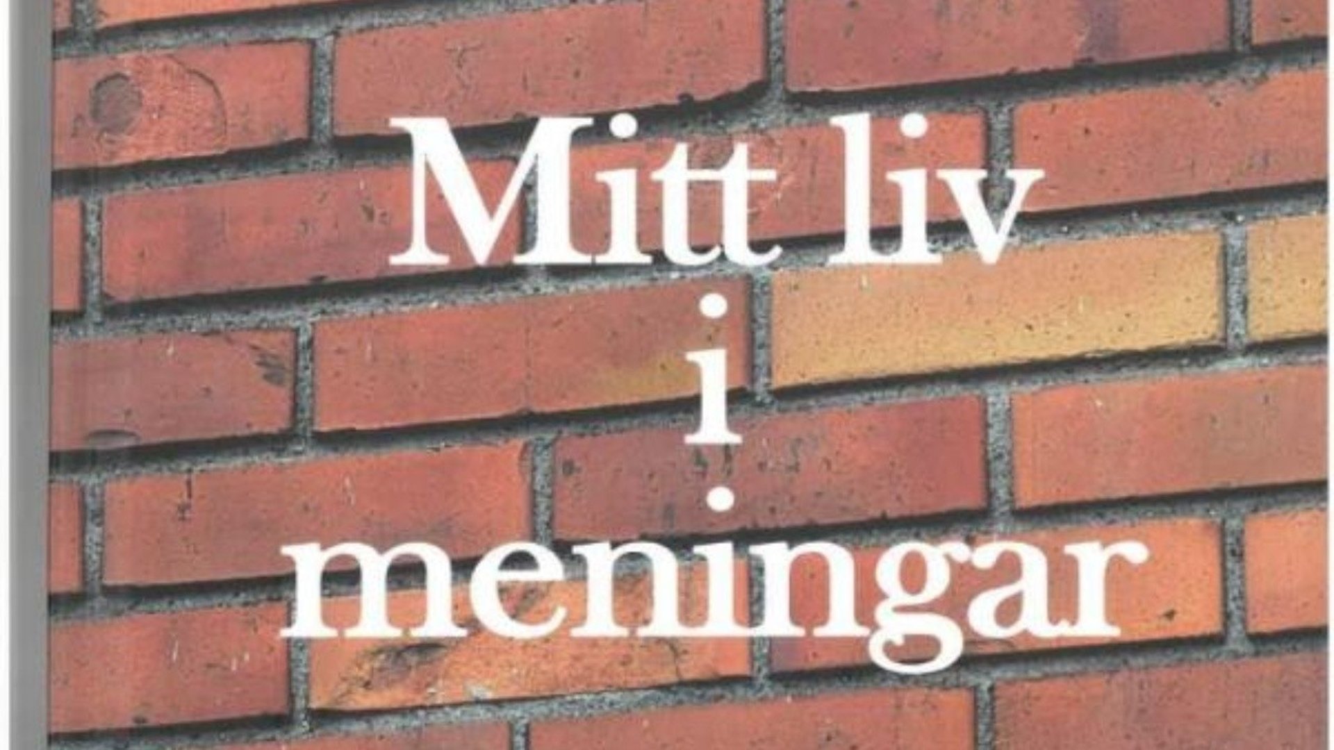 En brun tegelvägg med orden Mitt liv i meningar på.